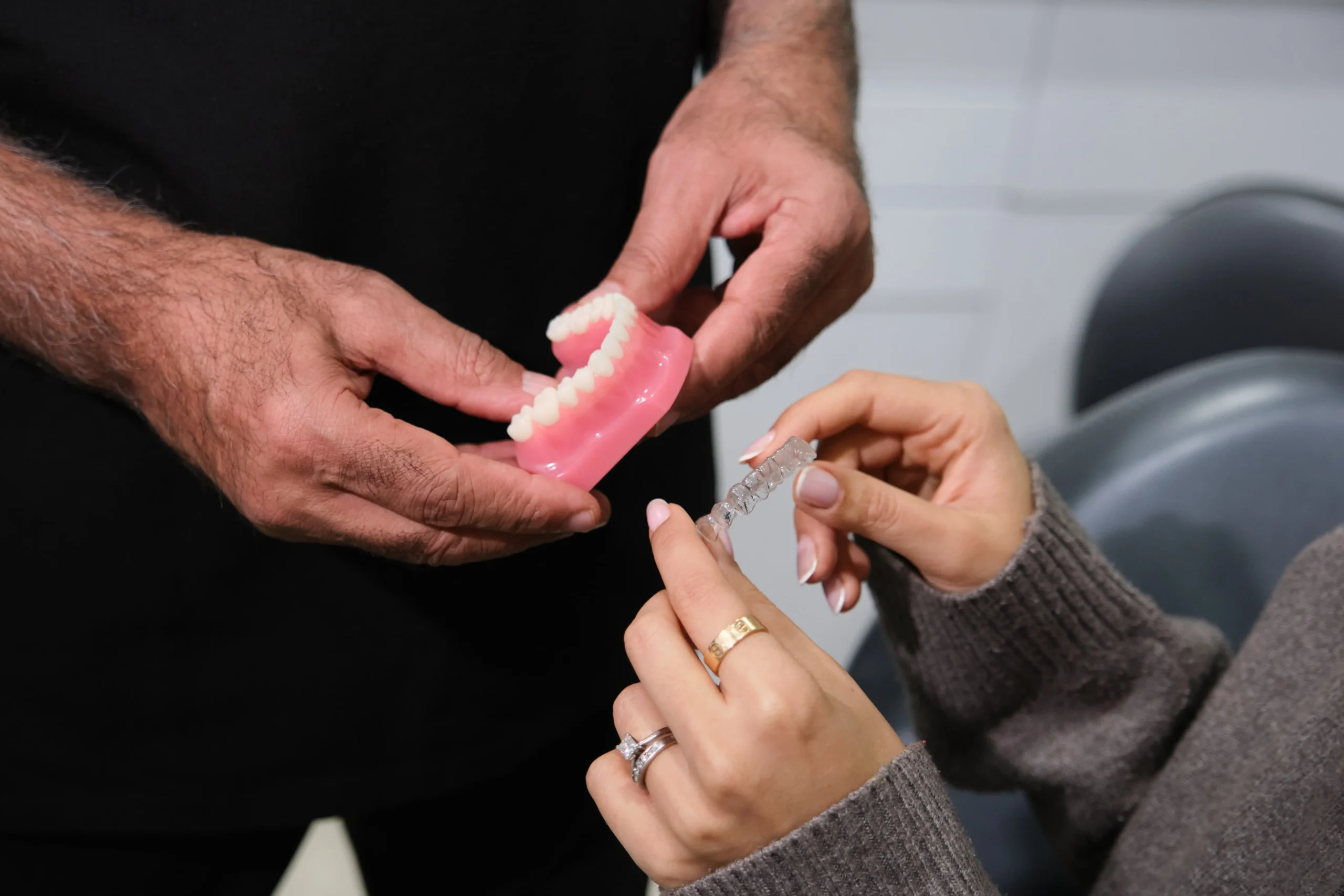 Dr Osman demonstrating Invisalign clear aligners at Face Dental, Coventry